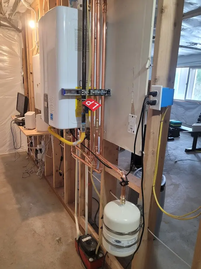 Licensed plumber repairing a kitchen sink in Zion
